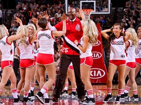 Former Trail Blazers player Jerome Kersey, seen here greeting the Blazer Dancers after a performance during a game in 2013, died Wednesday. He was 52. (Sam Forencich/NBAE via Getty Images/AFP)