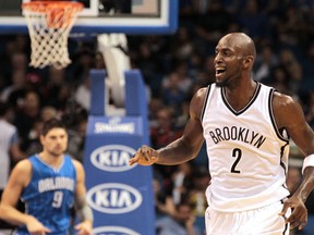 Brooklyn Nets forward Kevin Garnett (2) celebrates a basket during the second half of a NBA basketball game against the Orlando Magic at Amway Center. (Reinhold Matay-USA TODAY Sports)