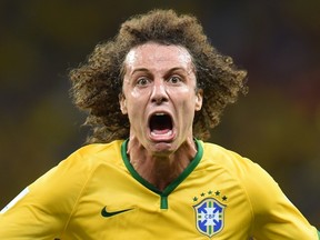 Brazil's defender David Luiz celebrates scoring during the quarter-final football match between Brazil and Colombia at the Castelao Stadium in Fortaleza during the 2014 FIFA World Cup on July 4, 2014. (AFP PHOTO / VANDERLEI ALMEIDA)