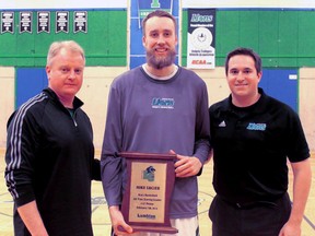 Mike Lucier was acknowledged last Saturday for becoming the Lambton Lions men's basketball all-time leading scorer by Lambton's athletic director John Faragher, left, and head coach James Grant. Lucier, from Forest, accomplished the feat in Sudbury against the Cambrian Golden Shield, eclipsing the old mark set by Sarnia native Chad Pereira. (SUBMITTED PHOTO)