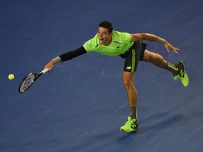 Canada's Milos Raonic plays a shot during his men's singles match against Serbia's Novak Djokovic at the 2015 Australian Open tennis tournament in Melbourne on January 28, 2015. (AFP PHOTO/WILLIAM WEST)