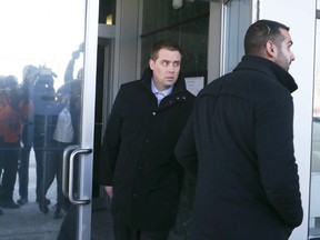 Toronto Police Const. Sameer Kara (front) and Toronto Police Const. Leslie Nyznik leaves court  on Thursday, Feb. 19, 2015 after he was released on bail. Veronica Henri/Toronto Sun/QMI Agency