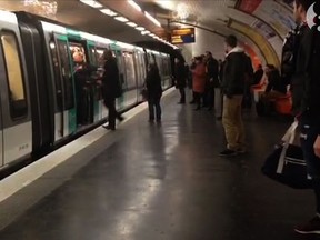 A video grab taken from footage obtained from Guardian News & Media Ltd in the United Kingdom on February 18, 2015 shows Chelsea fans packed onto a Paris Metro train pushing a passenger to prevent him from boarding the carriage at a station in Paris on February 17, 2015. (AFP PHOTO / GUARDIAN NEWS & MEDIA LTD)