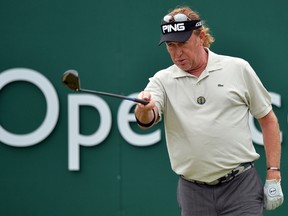 Spain's Miguel Angel Jimenez plays from the first tee at the Royal Liverpool Golf Course in Hoylake on July 14, 2014, ahead of The British Open. (AFP PHOTO/PAUL ELLIS)