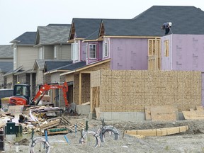 Recent analysis predicts construction of new homes, like these being built in the Creekview development off Fanshawe Park Rd., will increase, along with existing home sales, in 2015. (Free Press file photo)