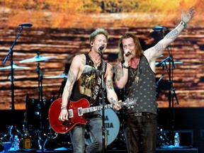 Musicians Brian Kelley (L) and Tyler Hubbard of Florida Georgia Line perform onstage during CBS Radio's The Night Before at US Airways Center on January 31, 2015 in Phoenix, Arizona.  Rick Diamond/Getty Images for CBS Radio/AFP