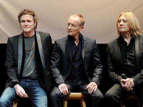 Musicians Rick Allen, Phil Collen and Joe Elliott of Def Leppard announce the KISS and Def Leppard "2014 Heroes Tour" at House of Blues on March 17, 2014 in West Hollywood, California.   Kevin Winter/Getty Images for Live Nation/AFP