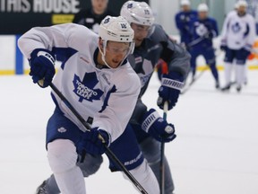 Maple Leafs’ Joffrey Lupul (right), skating during practice with Richard Panik, does not expect every player to be traded away. (JACK BOLAND/TORONTO SUN)