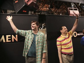 Ashton Kutcher and Jon Cryer wave goodbye on the set of Two and a Half Men.
Michael Yarish/CBS