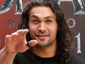 U.S. actor Jason Momoa poses for photographers during the presentation of the movie "Conan the Barbarian" in Madrid in this July 18, 2011 file photo.  REUTERS/Andrea Comas/Files