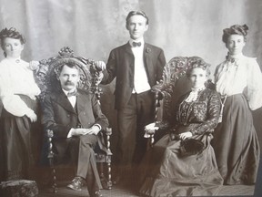 Unknown family may have Sarnia-Lambton connection. The photograph was found beneath a piece of artwork, purchased at a thrift store in Sarnia five years ago. Now the owners would like to know the identify of the people in the portrait. (submitted)