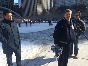Mayor John Tory makes the announcement in front of the Nathan Phillips Square ice rink. (DON PEAT/Toronto Sun)
