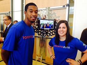 Toronto 2015 Pan Am Games athletes Dantae Richards-Kwong and Natalie Wideman were among the first to sign the Game's Twitter Mirror on Feb. 20, 2015 at a ceremony handing over the keys to the Athletes' Village to the Games organizing committee. (Kevin Connor/Toronto Sun)