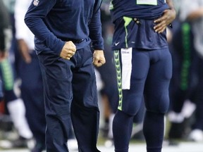 Seahawks head coach Pete Carroll reacts to a play against the Bears during NFL action in Seattle on Aug. 22, 2014. Seahawks running back Marshawn Lynch (24) is at right. (Joe Nicholson/USA TODAY Sports)