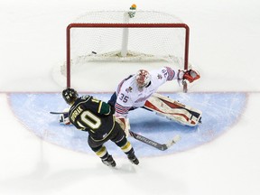 London Knights forward Christian Dvorak scores the winning shootout goal against Oshawa Generals goaltender Ken Appleby during their OHL junior hockey game at Budweiser Gardens in London on Friday February 20, 2015.  The Knights won the game 4-3 in the overtime shootout. (CRAIG GLOVER, The London Free Press)