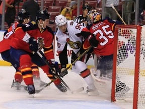 Florida Panthers goalie Al Montoya (35) makes a save on a shot by Ottawa Senators right wing Alex Chiasson (90) as defenseman Dylan Olsen (4) defends in the first period at BB&T Center. Mandatory Credit: Robert Mayer-USA TODAY Sports