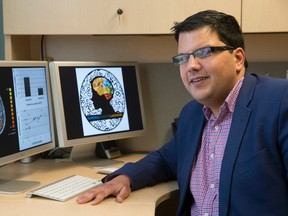 Dr. Daniel Ansari sits at his desk with MRI images of a child's brain on his computer monitor in Westminster Hall at Western University in London, Ontario on Friday February 20, 2015.  The psychology professor is one of 34 recipients of a Natural Sciences and Engineering Research Council of Canada award recognizing outstanding work by Canadian scientists and engineers. CRAIG GLOVER/The London Free Press/QMI Agency
