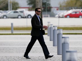 NASCAR driver Kurt Busch leaves the IMC building after a suspension appeal hearing on February 21, 2015 in Daytona Beach, Florida. Busch was suspended indefinitely by NASCAR after a no-contact order was issued against him for alleged abuse against his ex-girlfriend Patricia Driscoll.  Jonathan Ferrey/Getty Images/AFP