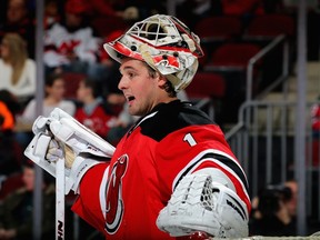 Keith Kinkaid #1 of the New Jersey Devils looks on from the net in the first period against the Carolina Hurricanes on February 21, 2015 at the Prudential Center in Newark, New Jersey.  Elsa/Getty Images/AFP