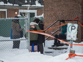 Family and friends gathered at the home of two siblings who were rushed to hospital after a fire broke out in the apartment at 75 Marangere St. in Gatineau late Saturday, Feb. 21, 2015.
DANI-ELLE- DUBE/OTTAWA SUN/QMI AGENCY