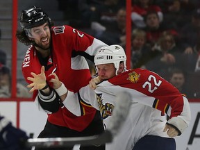 Ottawa Senators Jared Cowen and Florida Panthers Shawn Thornton fight during second period play at the Canadian Tire Centre in Ottawa Saturday, Feb. 21, 2015.  Cowen had just got out of the penalty box after a hit on Jussi Jokinen, for which Cowen faces a disciplinary hearing on Monday. Tony Caldwell/Ottawa Sun/QMI Agency
