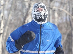 Daniel Faingold approaches the finish line of the Hypothermic Half Marathon at Fort Whyte Alive in Winnipeg, Man. Sunday February 22, 2015. (Brian Donogh/Winnipeg Sun/QMI Agency)
