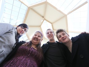 Oak Park High School student Philippe Burns (right) and friends Edith Fosseneueve, Shaylee Quill and Eric Koskie (from left) are part of a march against racism in Winnipeg. Photographed on Sun., Feb. 22, 2015. (Kevin King/Winnipeg Sun/QMI Agency)