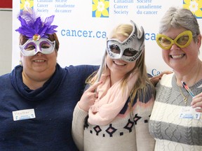 Heather Danen, along with Brittany Slack and her mom Diane, pose in a photo booth at a Relay Reunion event held in Sarnia Sunday. The event was a chance for Relay for Life participants to catch up and learn about changes coming at this year's June 19 fundraiser. TYLER KULA/ THE OBSERVER/ QMI AGENCY