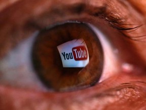 A picture illustration shows a YouTube logo reflected in a person's eye, in central Bosnian town of Zenica, early June 18, 2014. REUTERS/Dado Ruvic