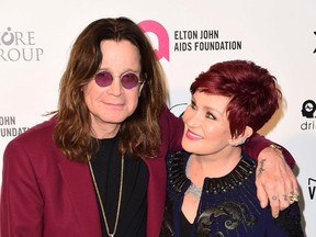Singer Ozzy Osbourne and his wife Sharon arrive at the 2015 Elton John AIDS Foundation Oscar Party in West Hollywood, California February 22, 2015. REUTERS/Gus Ruelas