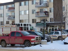Fire crews respond to a building in Fort McMurray, Alta., where a substance spill sent five children to the hospital Sunday. (ANDREW BATES/QMI Agency)