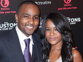 Bobbi Kristina Brown (R) and Nick Gordon attend the opening night of "The Houstons: On Our Own" in New York, in this file photo taken October 22, 2012. REUTERS/Andrew Kelly/Files