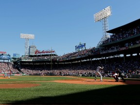 Boston Red Sox pitcher Clay Buchholz (11) pitches to New York Yankees shortstop Derek Jeter (2) during the first inning at Fenway Park.  Greg M. Cooper-USA TODAY Sports