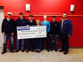 Secure Energy Services from different divisions presented a cheque of $4500 to members of the Boys and Girls Club.