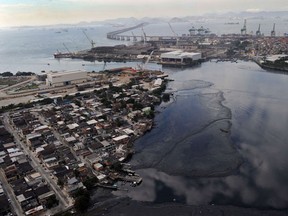 Aerial view of the polluted Caju port area in the Guanabara bay, where some of the Olympic Games 2016 water sports competitions will take place. (AFP/ANTONIO SCORZA)