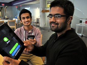 Ali Malik, 17, (left) and Salar Ali, 18, at Western University in London Ont. Feb. 12, 2015. The local students have created a smartphone-focused classifieds app that will launch in beta at the end of March. CHRIS MONTANINI\LONDONER\QMI AGENCY