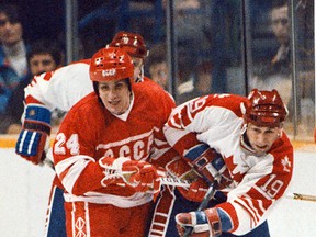 Russian superstar Sergei Makarov battles Canada's Vaughn Karpan at the 1988 Winter Games in Calgary. (QMI Agency file)