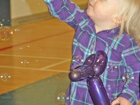 Jordan Tamblyn reaches for a bubble during the Mitchell Kinettes Family Day event at Mitchell District High School last Monday, Feb. 16. KRISTINE JEAN/MITCHELL ADVOCATE