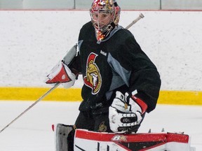 Ottawa Senators goaltender Craig Anderson prepares to make a save during practice at the Sensplex on Monday February 23, 2015. This was Anderson's first full practice in over a month after sustaining a hand injury. (Errol McGihon/Ottawa Sun/QMI Agency)
