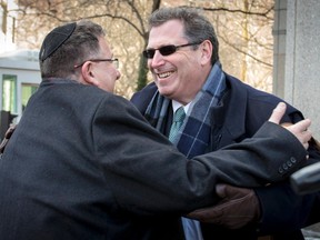 Kent Yalowitz (R), lawyer for families suing over attacks attributed to the al-Aqsa Martyrs Brigades and Hamas, is greeted by Mark Weiss outside the Manhattan Federal Courthouse following a jury's decision in New York February 23, 2015. A U.S. jury on Monday ordered the Palestine Liberation Organization (PLO) and the Palestinian Authority to pay more than $218 million for providing material support to terrorists, a victory for Americans suing over attacks in the Jerusalem area more than a decade ago. REUTERS/Brendan McDermid
