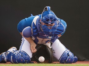 Blue Jays catcher Russell Martin blocks a pitch during a morning workout at Bobby Mattick Training Center in Dunedin yesterday. (USA Today/photo)