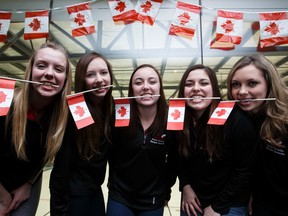 Team Canada pose for a photo during their send off at the Saville Sports Centre on Monday. From left, third Danielle Shmiemann, second Holly Jamieson, skip Kelsey Rocque, lead Jessica Iles and fifth Kirsten Streifel head to Tallinn, Estonia for the 2015 World Junior Curling Championships. (Ian Kucerak, Edmonton Sun)