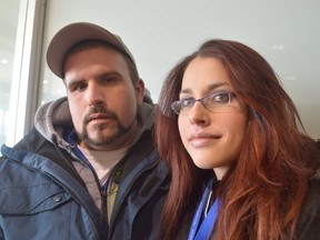 Jim Moodie/The Sudbury Star
Everest College students Josh Brohart and Nakita Dumont stand inside the Rainbow Centre following a rally Monday at Paris and Elm streets. The students are hoping classes can resume at the college, which was forced to shut down last week.