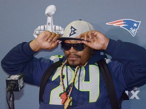 Seahawks running back Marshawn Lynch is looking to trademark the phrase "I'm just here so I won't get fined" after using it during Super Bowl to avoid answering questions from the media. (Kirby Lee/USA TODAY Sports)