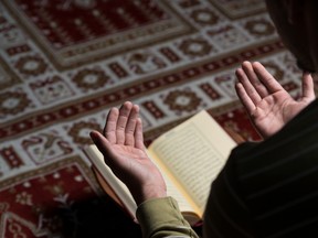 Man praying with the Quran. 

(Fotolia)