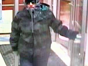 Gatineau police say this man is a suspect in the robbery of a woman at a Desjardins bank ATM on Jan. 31. (Gatineau Police submitted image)
