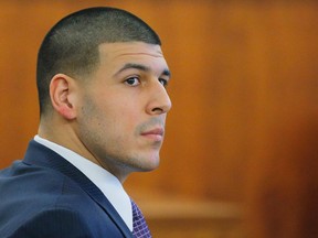 Former New England Patriots player Aaron Hernandez listens to testimony, during his murder trial at Bristol County Superior Court in Fall River, Massachusetts, February 24, 2015. Hernandez is accused of the murder of Odin Lloyd in June 2013.    REUTERS/Brian Snyder