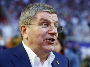 International Olympic Committee president Thomas Bach walks on the field prior to Super Bowl XLIX at University of Phoenix Stadium on February 1, 2015. (Tom Pennington/Getty Images/AFP)