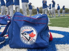 Toronto Blue Jays players begin to stretch on the field during morning workouts at Bobby Mattick Training Center. (Tommy Gilligan/USA TODAY Sports)