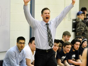 Mitchell DHS senior boys coach A.J. Moses is his usual demonstrative self on the sidelines, helping to guide the Blue Devils to a 45-40 win over St. Mike’s in their Huron-Perth quarter-final game. ANDY BADER/MITCHELL ADVOCATE